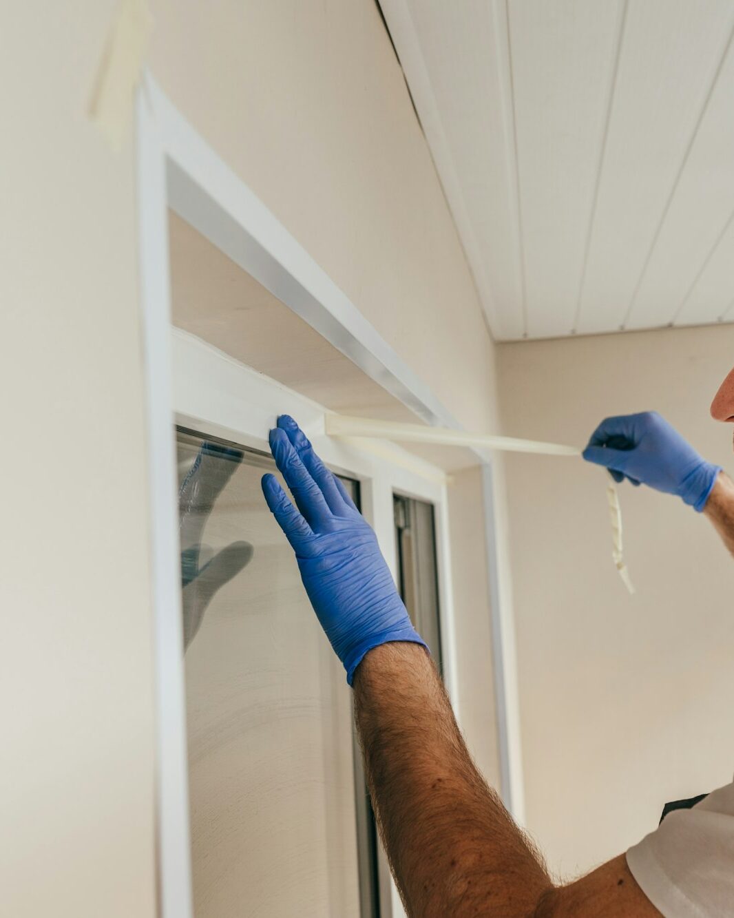 Young man using waterproof silicone and spatula