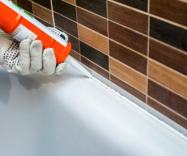 work sealing in the bathroom with silicone sealant