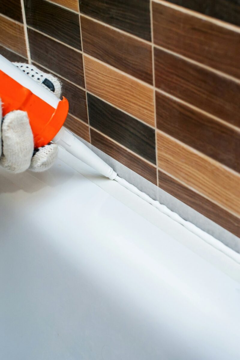 work sealing in the bathroom with silicone sealant